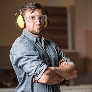 Male Carpenter Wearing Protective Gear - Lead Image for Carpenters Page