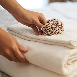 Room Attendant Fixing Towels - Lead Image for Hospitality Page