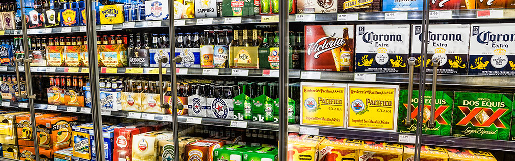 Various Alcoholic Drinks Displayed on Shelf - Lead Image for Liquor Stores Page