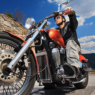 Inszone Insurance Motorcycle Insurance Page Banner - Male Driver Riding a Motorycle