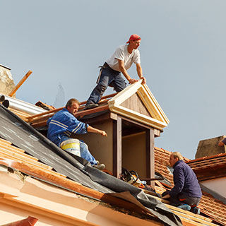 Construction Workers Building a Roof - Lead Image for Roofers Page