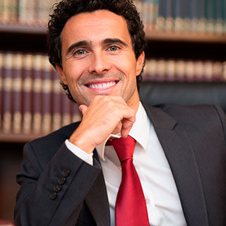 Male Wearing Corporate Attire Smiling - Lead Image for Professional Services Page